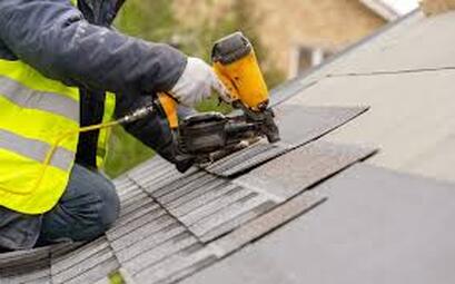 Picture of roofer putting on roof
