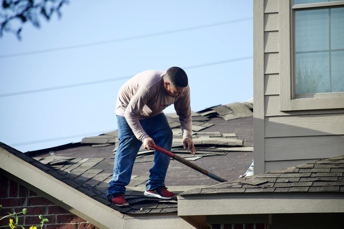 Picture of roofer working on roof